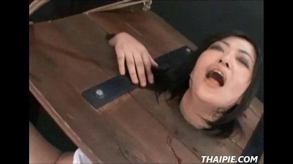 Asian In A Stockade Made to Orgasm