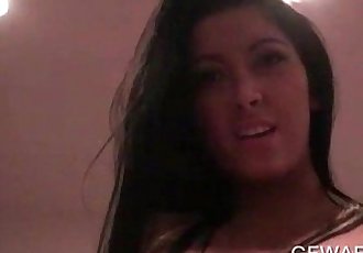 Bitchy naked brunette filling her slick hairy twat with cock