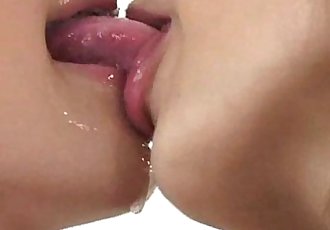 Two Japanese girls wet kissing close-up - 22 sec
